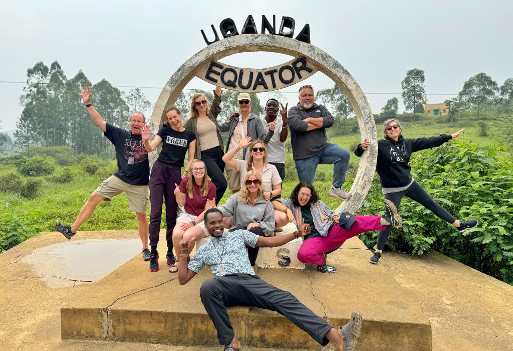 Visitors at the Uganda Equator monument, a popular day trip